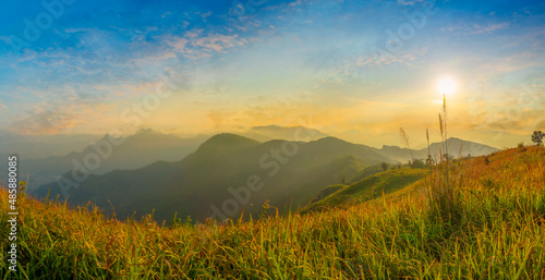 Beautiful landscape nature in morning on peak mountain with sunlight cloud fog and bright blue sky in winter at Phu Chi Fa Forest Park is a famous tourist attraction of Chiang Rai Province  Thailand