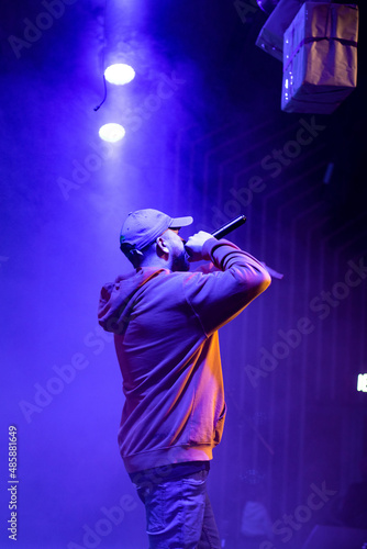 singer and rapper on stage in smoke © Karen Remez
