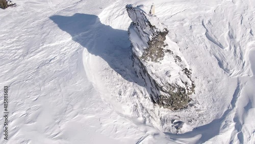 Smooth rotation of the drone camera over the monument, in honor of the dead tourists on the Dyatlov Pass. photo