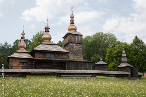 The Greek Catholic wooden church of St Paraskieva from village Nova Polianka located in open air ethnographic museum of Svidnik, Slovakia photo