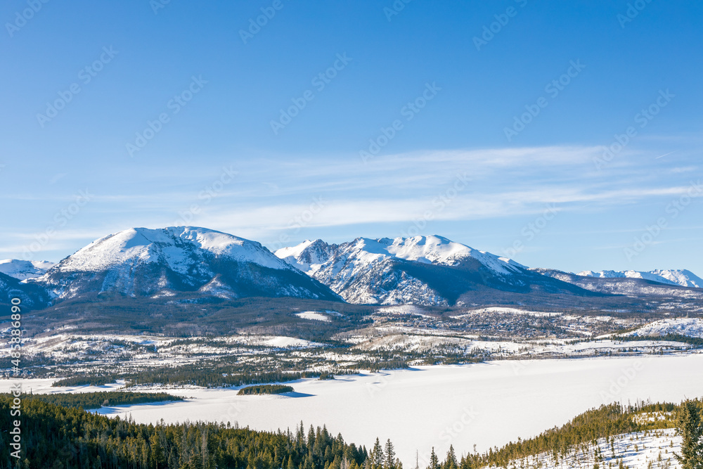 Beautiful winter landscape with evergreen trees and ski tracks in the Rocky Mountains, Colorado, near lake Dillon