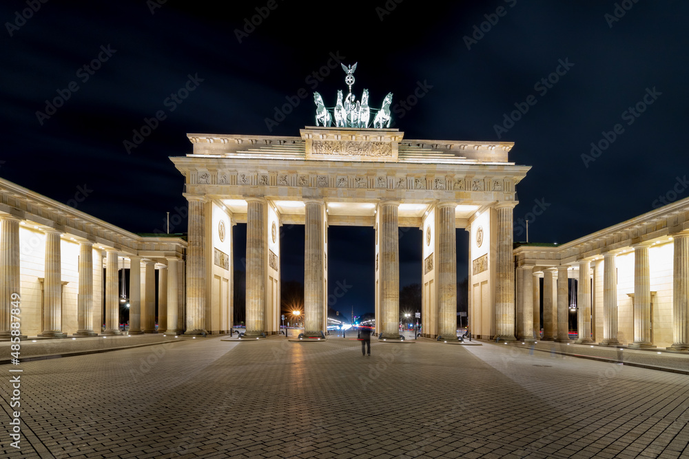 Night cityscape of the famous city gate Brandenburger Tor in the evening, Neoclassical monument, One of the best-known landmarks of Germany, Located in the western part of the city centre of Berlin.