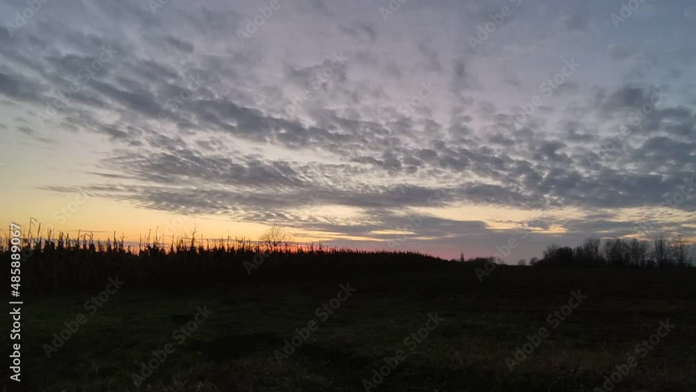 Winter dusk sky with corn field in the countryside. 4K time lapse. Winter dusk sky with corn field in the countryside. 4K time lapse.