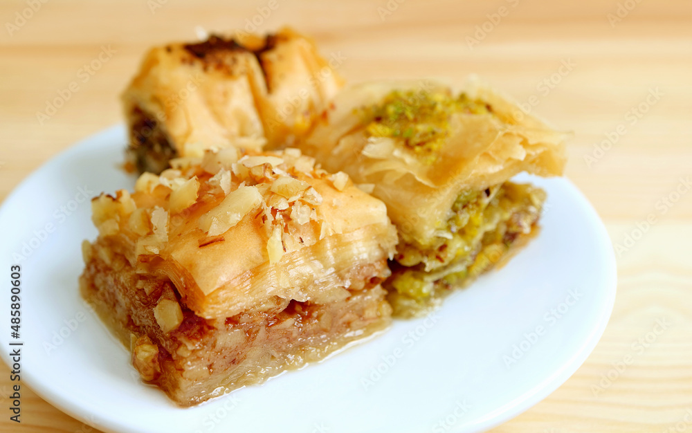Closeup of Mouthwatering Assorted Baklava Pastries on a White Plate