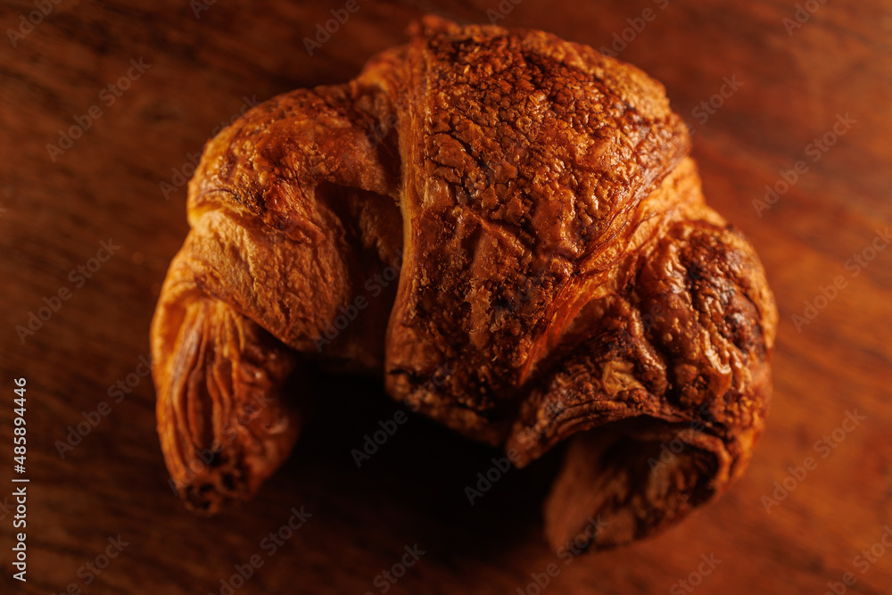 Fototapeta premium French Croissant closeup on wood