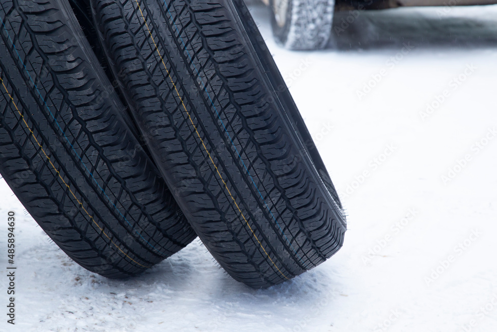A set of summer tires for a car on the street.Replacement of car tires. A set of summer tires for a car on the street.Replacement of car tires.