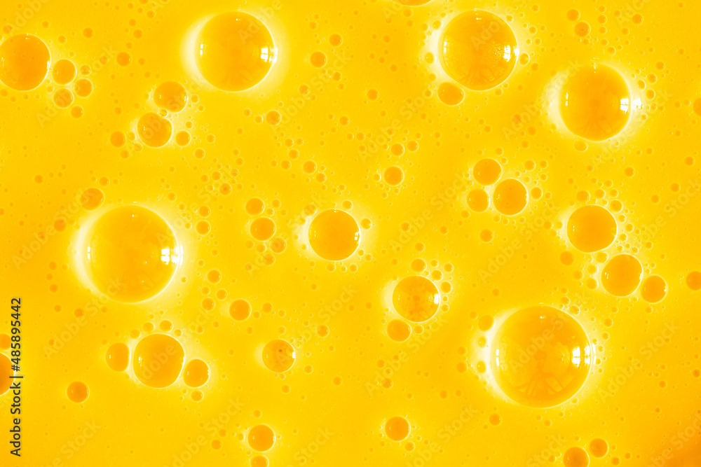 Orange juice. Bubble yellow texture background. Berry gel to cleanse the skin of the face and body. Spa treatments, skin care. Bath foam, detergent. Gold slime Orange juice. Bubble yellow texture background. Berry gel to cleanse the skin of the face and body. Spa treatments, skin care. Bath foam, detergent. Gold slime