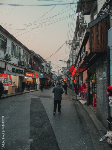 Shanghai streets with urban life and small shops © Maxence