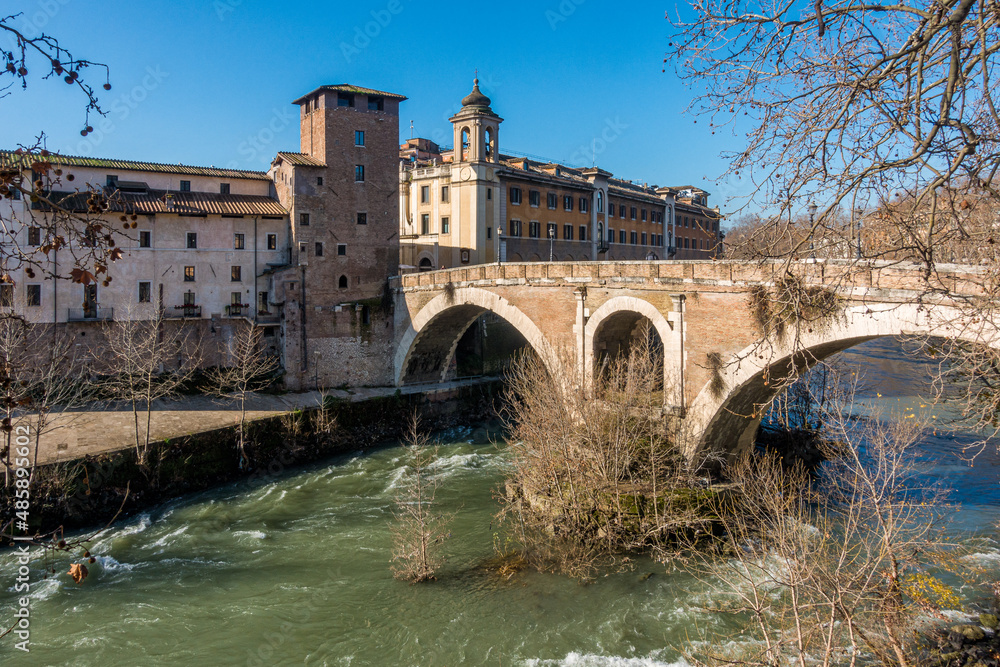 Tiber Island and Fabricio's Bridge as seen from the riverside, Rome, Italy.