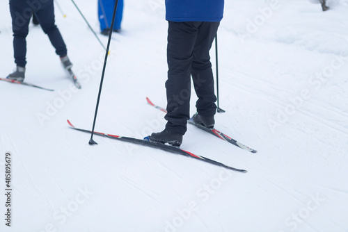Cross country skilling.Skiers are skiing in the winter forest.