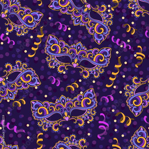 Carnival masks. Vector seamless pattern. In yellow-purple.