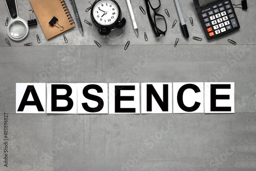 ABSENCE text on white stickers on gray marble background business concept