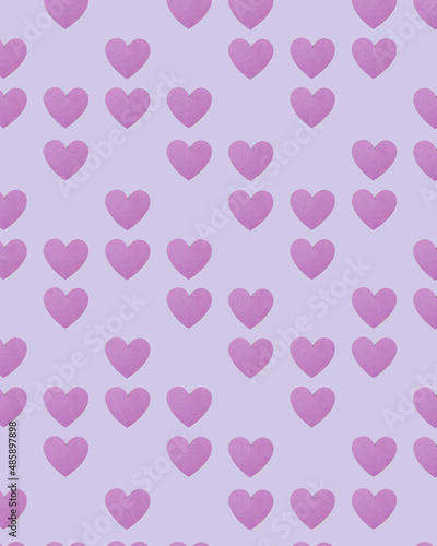 Pattern made of purple heart shapes on pastel purple background. Minimal romantic  monochromatic idea for valentines day. Aesthetic love concept.