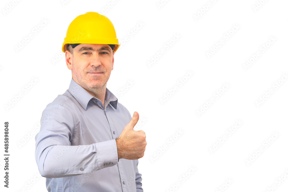 A man in a helmet shows a gesture with his hands. A man builder A man in a helmet shows a gesture with his hands. A man builder