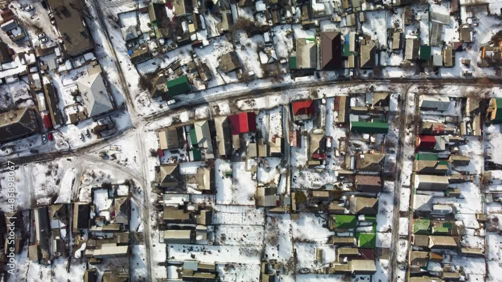 view of a small snow-covered town from the air view of a small snow-covered town from the air