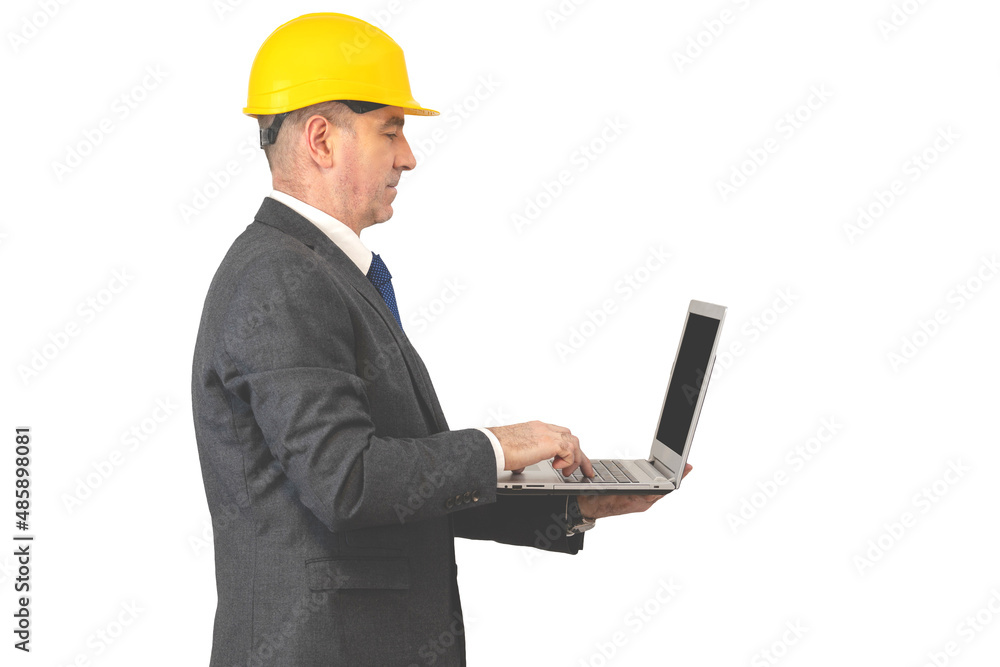 builder with a laptop. man in suit and helmet with notebook builder with a laptop. man in suit and helmet with notebook