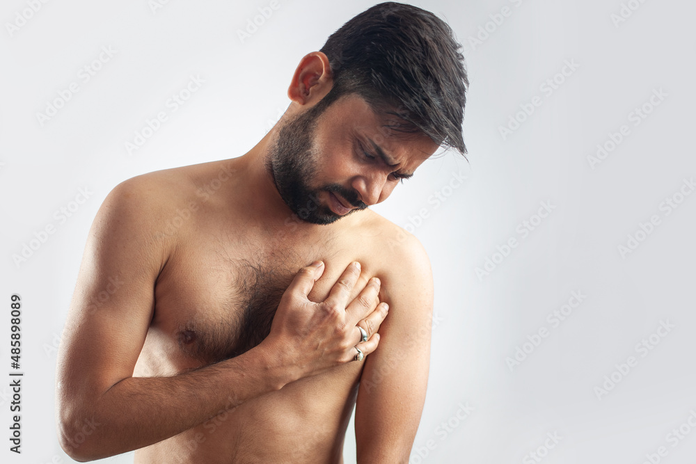 Obraz premium asian man clutching his chest in pain, heart attack, heart burning pain