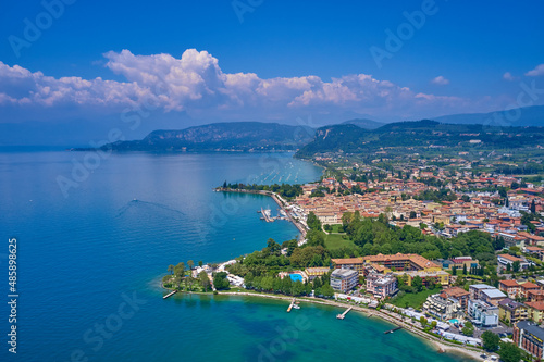 Docked yachts parking in Port. Aerial photography. Beautiful coastline. In the city of Bardolino, Lake Garda is the north of Italy. View by Drone.