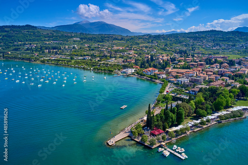 Aerial photography with drone. Beautiful coastline. In the city of Bardolino, Lake Garda, Italy.