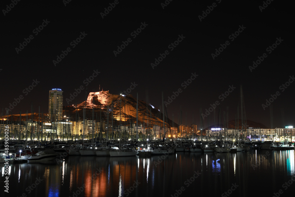 View of the Santa Barbara castle at night from the port of Alicante