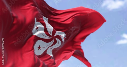 Detail of the civil flag of Hong Kong waving in the wind on a clear day. photo