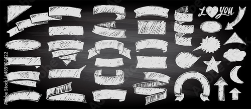 Assorted chalk style ribbons and elements set on a chalkboard background