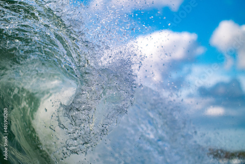 Crashing Wave detail with blue sky in background