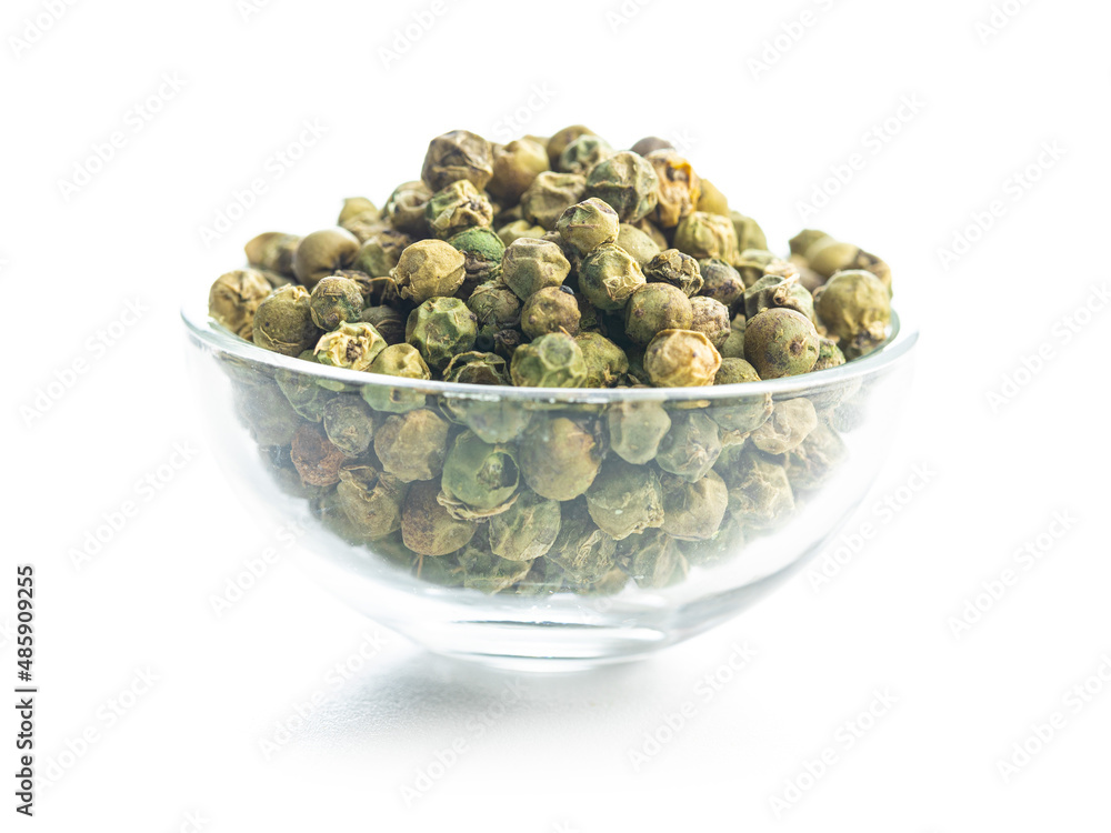 Dried green peppercorn. Dry green pepper spice in bowl isolated on white table. Dried green peppercorn. Dry green pepper spice in bowl isolated on white table.