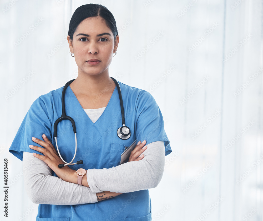 Nursing you back to health is of utmost importance. Shot of a medical practitioner standing with her arms crossed. Nursing you back to health is of utmost importance. Shot of a medical practitioner standing with her arms crossed.