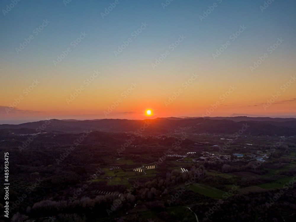 Aerial drone view of sunset in corfu greece