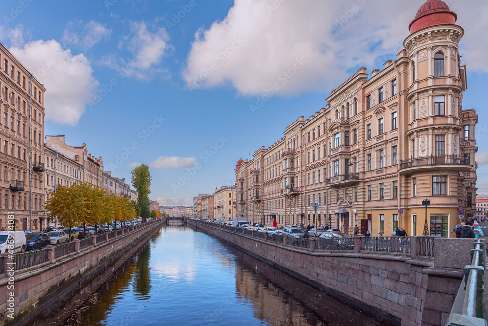 view of the canal with granite banks and beautiful old buildings on the embankment in the historical part of the Russian city of St. Petersburg