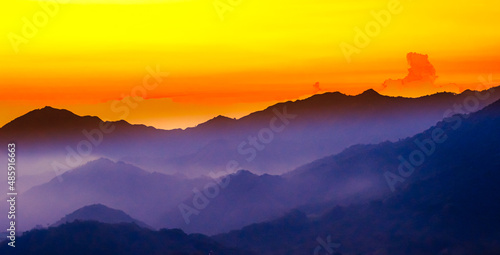 Purple Mountain Silhouette during sunset with fog in Minca, Colombia photo