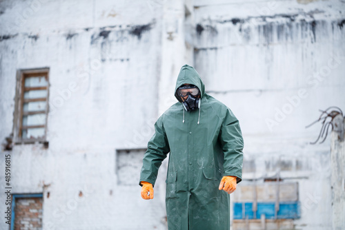 A man in a protective mask and protective clothing explores a dangerous radioactive area. © Дмитрий Ткачук