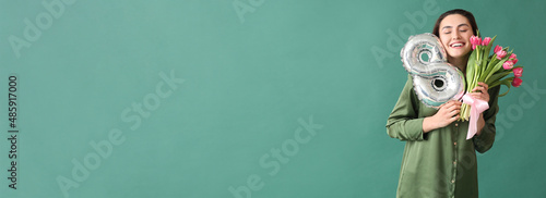 Happy young woman with bouq...