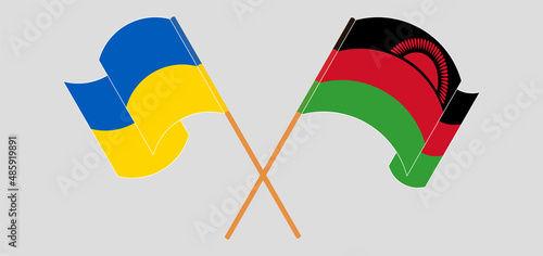 Crossed and waving flags of Ukraine and Malawi