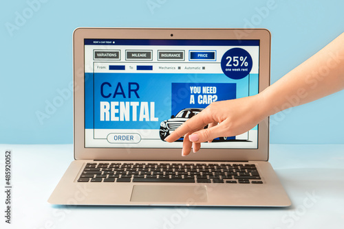 Female hand and laptop with...