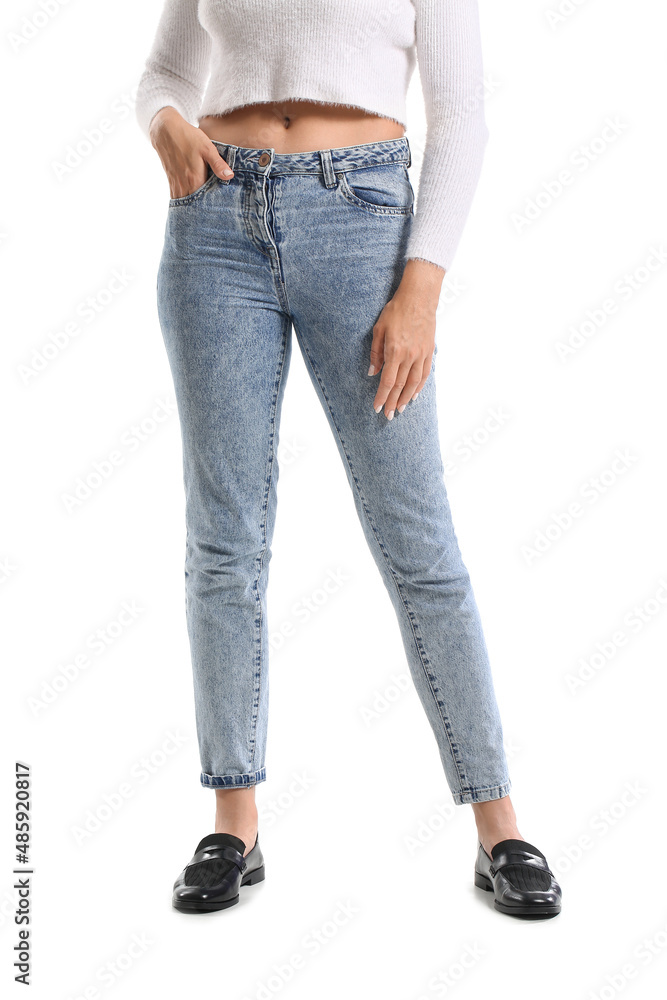 Fashionable young woman in stylish jeans on white background Fashionable young woman in stylish jeans on white background