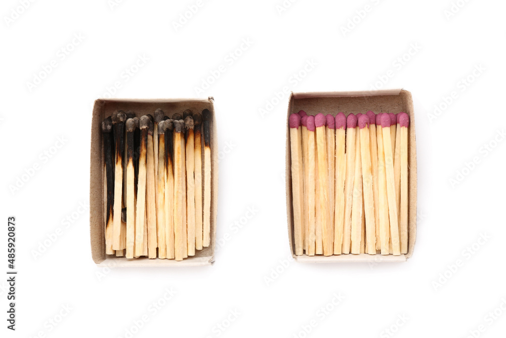 Matchboxes with whole and burnt matches on white background. Emotional burnout concept Matchboxes with whole and burnt matches on white background. Emotional burnout concept
