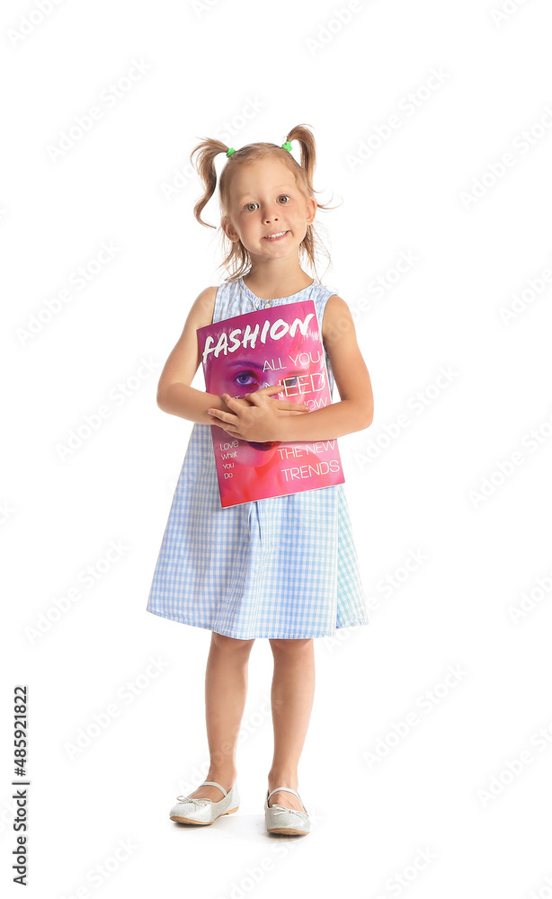 Adorable little girl with magazine on white background Adorable little girl with magazine on white background
