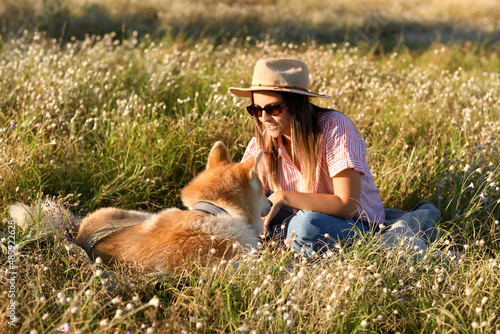 Funny Akita Inu dog with ow...