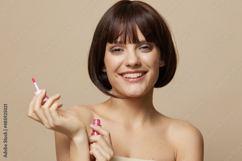 woman makeup lipstick in hand model posing isolated background woman makeup lipstick in hand model posing isolated background