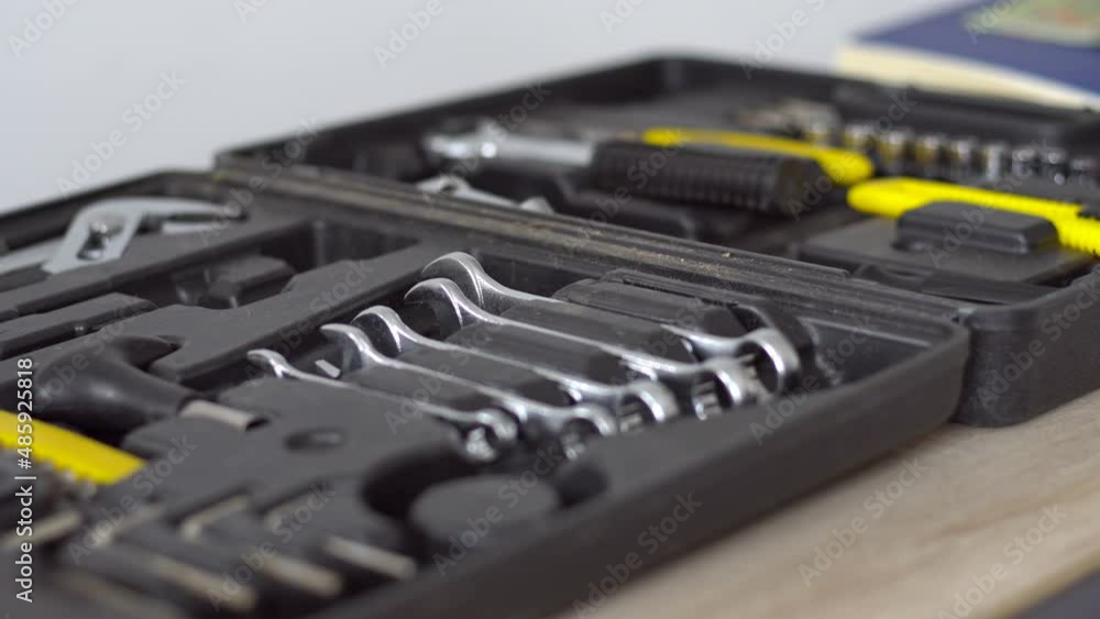 Male Hand Selecting A Wrench From A Instruments Set. Auto Repair Kit In Toolbox. Closeup. Male Hand Selecting A Wrench From A Instruments Set. Auto Repair Kit In Toolbox. Closeup.