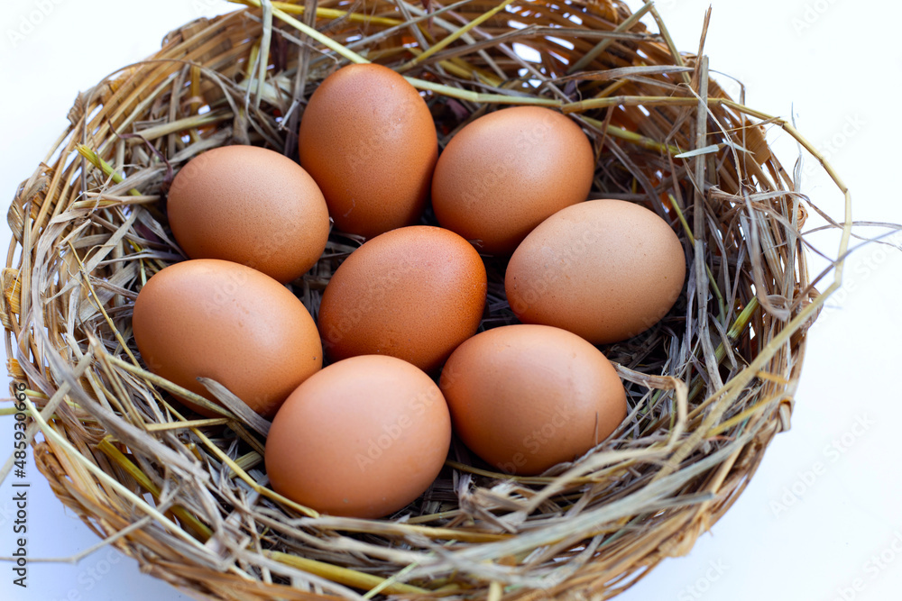 Fresh organic eggs in a straw nest Fresh organic eggs in a straw nest