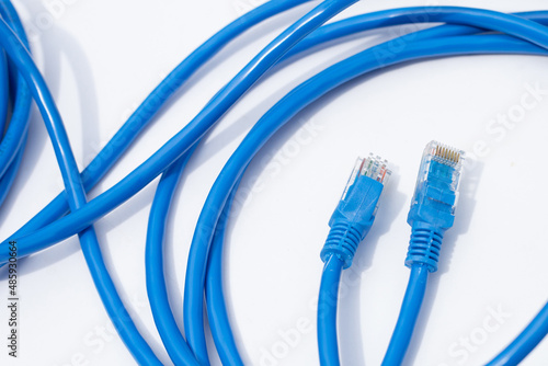 LAN network connection ethernet blue cables on white background.