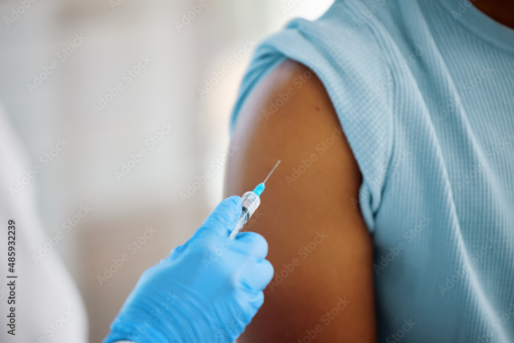 This vaccine will change my life. Shot of a doctor about to inject the arm of a patient. This vaccine will change my life. Shot of a doctor about to inject the arm of a patient.