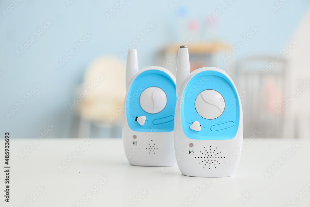 Modern baby monitors on table in room Modern baby monitors on table in room