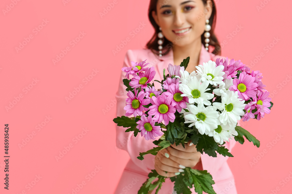 Beautiful woman holding bouquet of flowers on pink background, closeup. International Women's Day Beautiful woman holding bouquet of flowers on pink background, closeup. International Women's Day