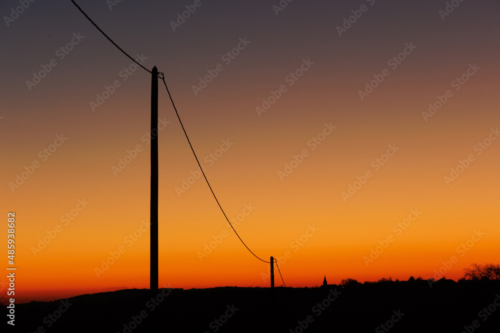 landscape after sunset with silhouette an electric
