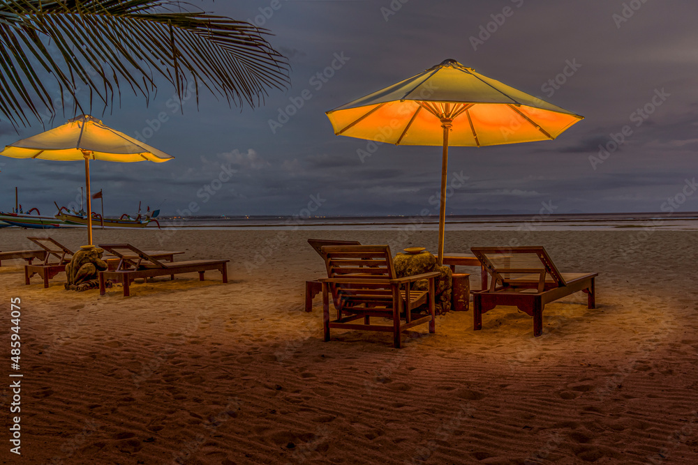 Sunbeds in evening light at Sanur Beach on the Island of Bali