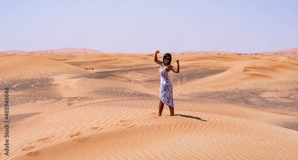 Strong brown woman in the desert